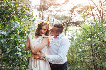 Beautiful happy couple on a walk in the woods