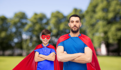 man and boy wearing mask and red superhero cape