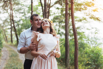 Fototapeta premium Walk a happy young couple on the nature