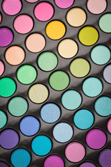 Colorful glossy make-up palette background
