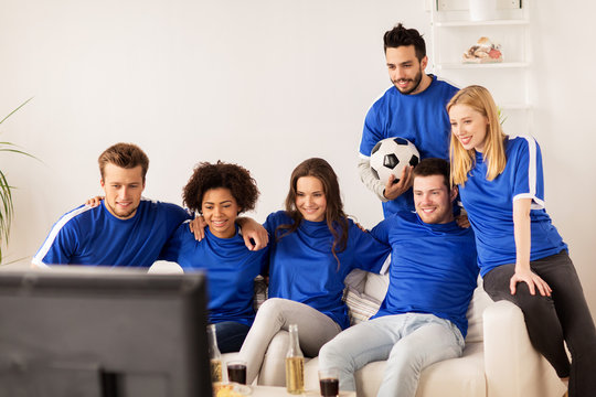 Friends Or Football Fans Watching Soccer At Home