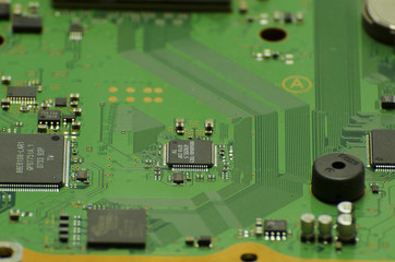 Microchips on a circuit board with lines closeup