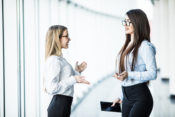 Portrait Of Happy Business People Discussing Together In Office