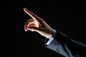 close up of hand pointing finger to something