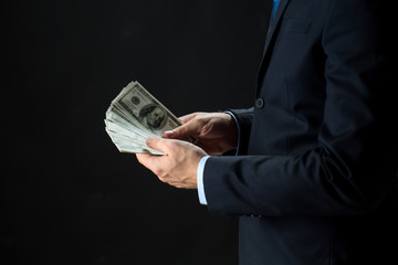 close up of businessman hands holding money
