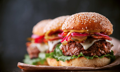 a delicious and juicy burger home in a rustic style with a big chop of beef