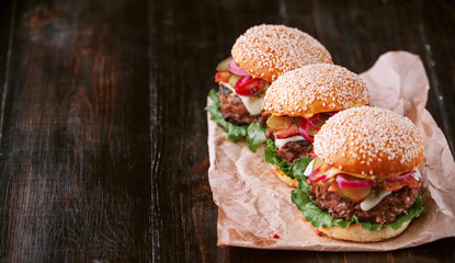 a delicious and juicy burger home in a rustic style with a big chop of beef