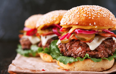 a delicious and juicy burger home in a rustic style with a big chop of beef