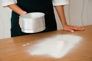 Obraz na płótnie Canvas Chef preparing dough - cooking process