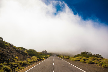 Fototapeta na wymiar Road over clouds on Teide mountains in Tenerife, Canary Islands