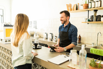 Barista taking order with a tablet
