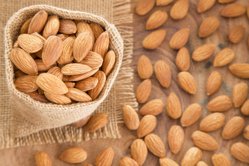 Almonds on the wooden background