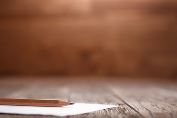 Wooden Desk Table, White Clipboard with Blank Paper. Copy space for text or Image