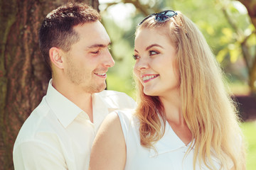 Happy couple having romantic date in park