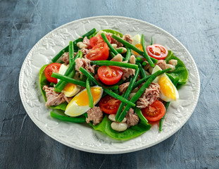 Fresh Tuna Green Bean salad with eggs, tomatoes, beans on white plate. concept healthy food