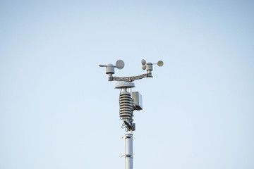 Weather station on blue sky background