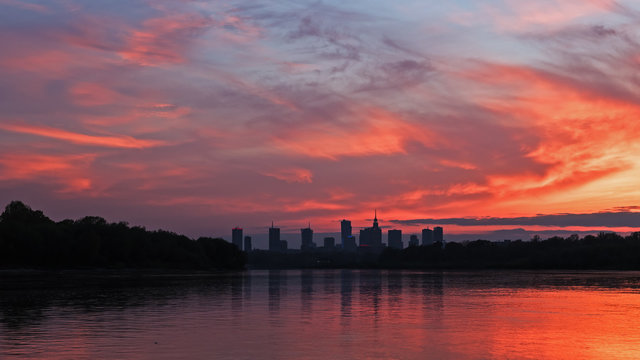 Silhouette of the city of Warsaw against the sky at sunset