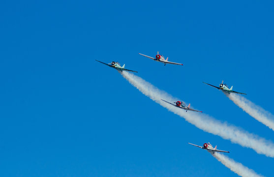 Vintage Planes In Formation With Smoke Trails