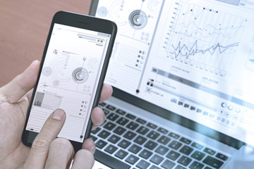close up of hand using smart phone,laptop, online banking payment communication network technology 4.0,internet wireless application development sync app,filter effect