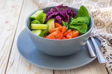 Green salad with  tomato, red cabbage, cucumber and spinach