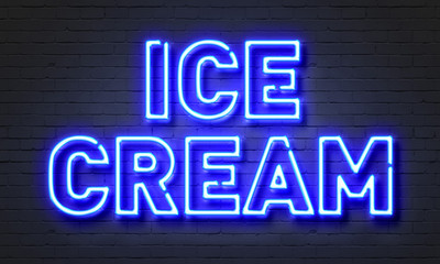 Ice cream neon sign on brick wall background.