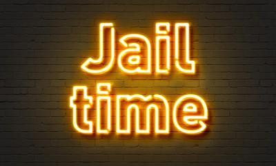 Fototapeta na wymiar Jail time neon sign on brick wall background.