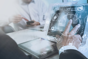 Designer and Businessman using smart phone and digital tablet and laptop computer in modern office with virtual screen interface icons diagram as concept