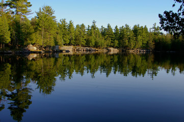 Fototapeta na wymiar Small dock on a calm lake in Canada
