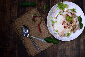 spicy stir fried chicken with basil leaf on rice in foam box for take home,fast food,.fried rice with basil