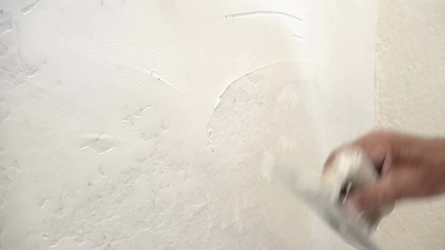 plasterer concrete worker at wall 
