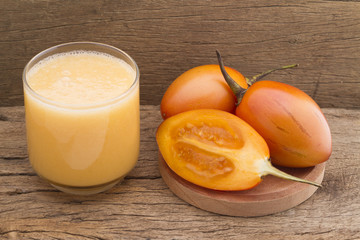 Tamarillo fruit (disambiguation) from South America, on wooden background
