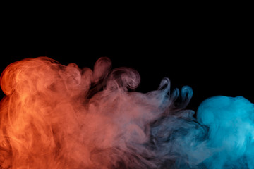Abstract smoke Weipa. Personal vaporizers fragrant steam. Concept of alternative non-nicotine smoking. Turquoise orange smoke on a black background. E-cigarette. Evaporator. Taking Close-up. Vaping.