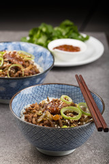 Dan Dan mian- a traditional noodle dish from Sichuan Province in China. 