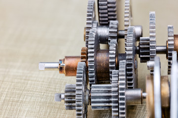 gear cogwheels mechanism closeup on industrial scratched background