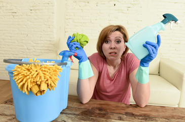 woman cleaning living room table with cloth and spray bottle tired in stress