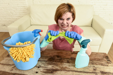 woman cleaning living room table with cloth and spray bottle tired in stress