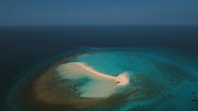 Aerial view of beautiful sand tropical island with white sand beach. White sand island. Beautiful sky, sea ,resort. Seascape: ocean and beautiful beach paradise. Philippines, Camiguin. 4K video