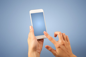 Female hand holding smartphone