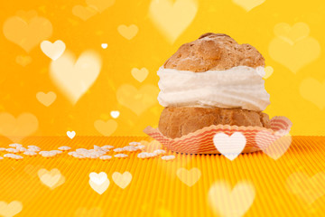 Delicious party cakes with heart shape symbols on colorful background