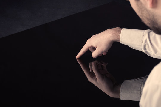 Close up of a hand touching smart table with copy space