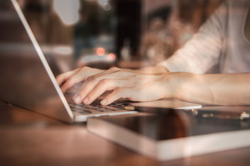 Business women work with  laptop,pen and notebook on the wooden table in business and working concept