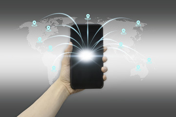 Communications concept with touch screen mobile phone in people hand