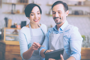 Positive couple manging their little business