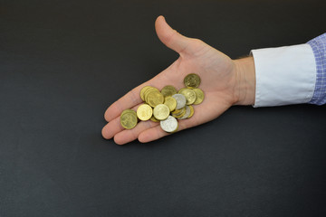 Coins in hand. Bronze coins in man's hand