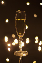 Goblet white wine isolated on black background