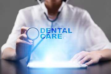 Medical doctor working with modern computer and pressing button dental care. Medical concept.