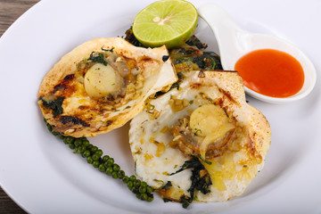 Baked scallops with spinach