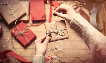 hands wrapping gift