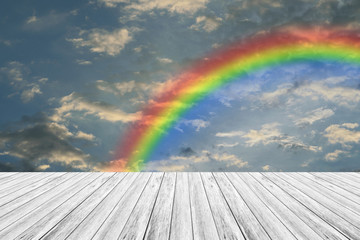 Wood terrace and Blue sky with rainbow