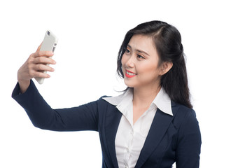 Fototapeta premium Asian businesswoman taking selfie photo by smartphone.